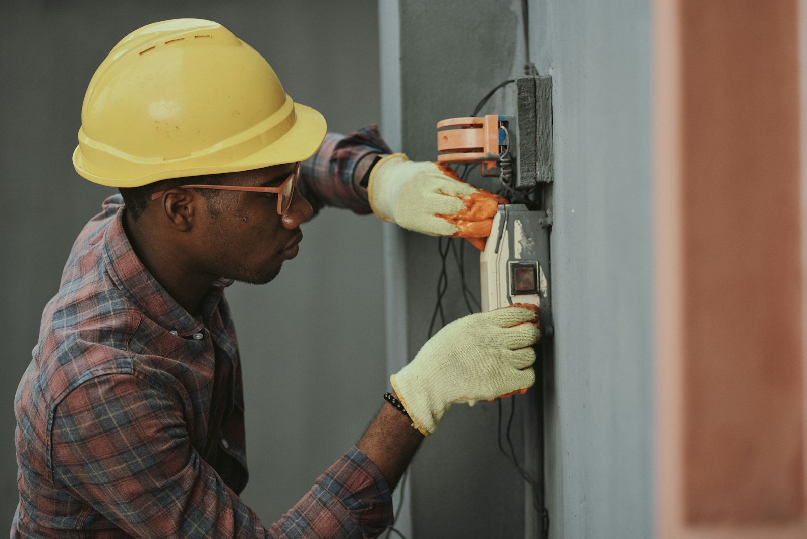 Technician working on an electrical panel